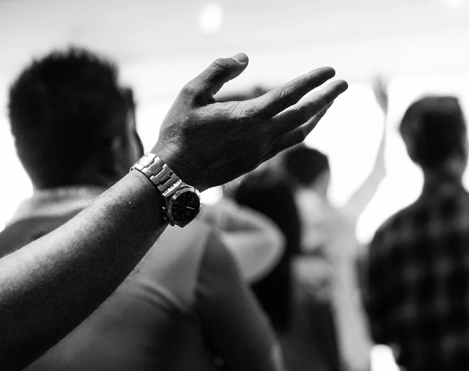Worship photograph from the church’s adult ministries page